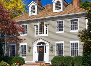 A two-story colonial home with new siding
