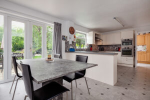 Modern kitchen with patio doors leading to a garden